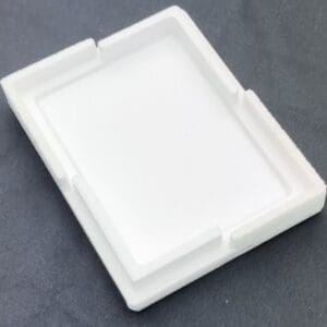 A white plastic tray sitting on top of a table.