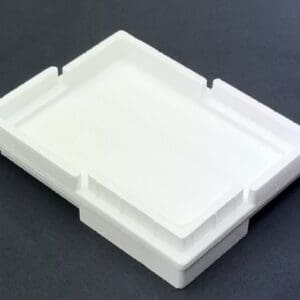 A white plastic tray sitting on top of a table.