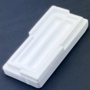 A white plastic container sitting on top of a table.