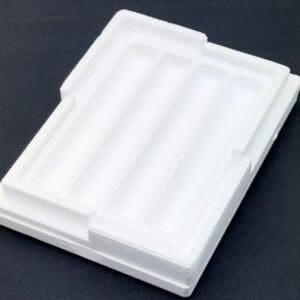 A white plastic container sitting on top of a table.